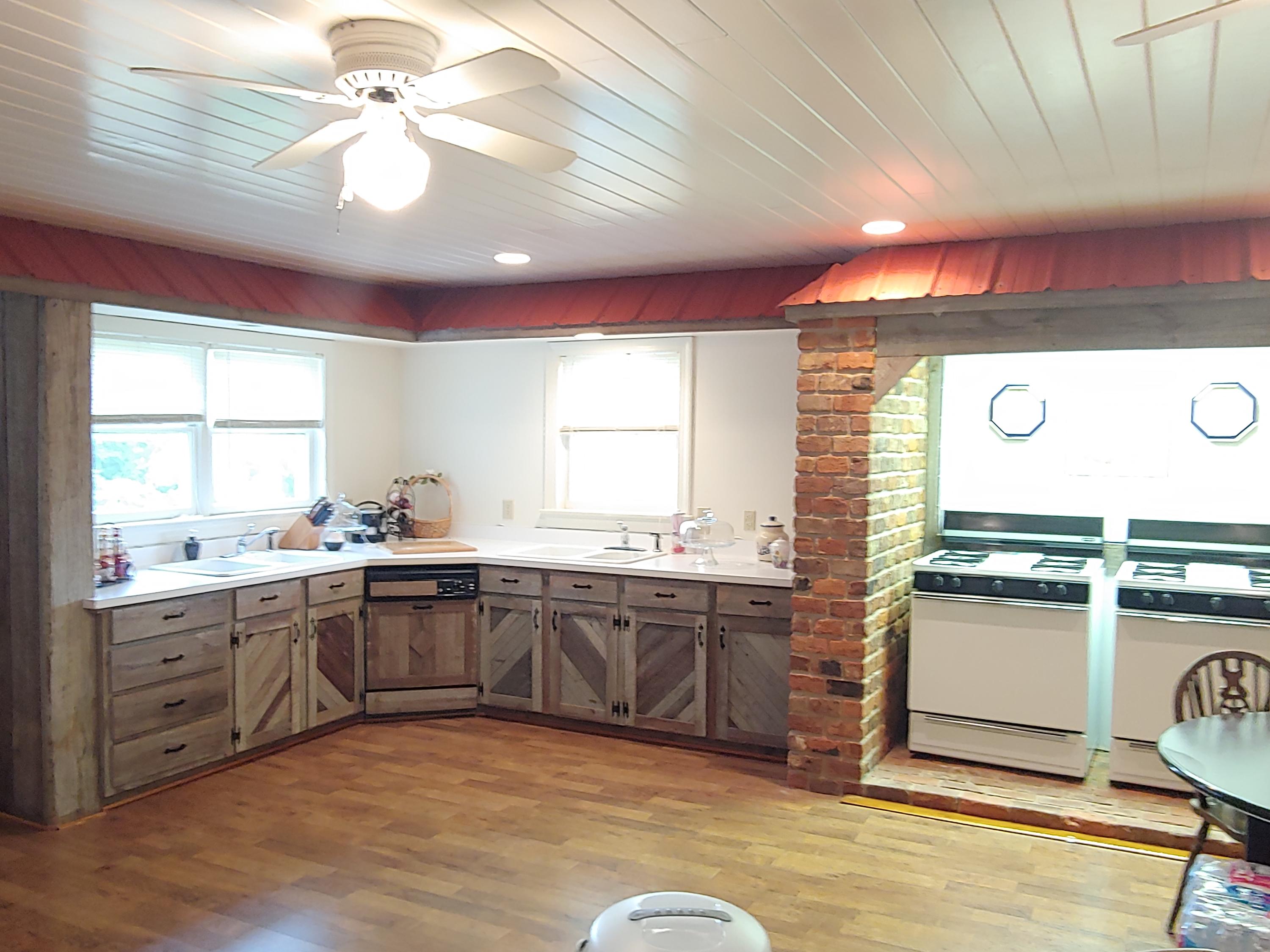 136 Old Fields Road Southwest Floyd, VA 24091 - Photo 31 of 71 a large kitchen with a stove a sink dishwasher and a refrigerator
