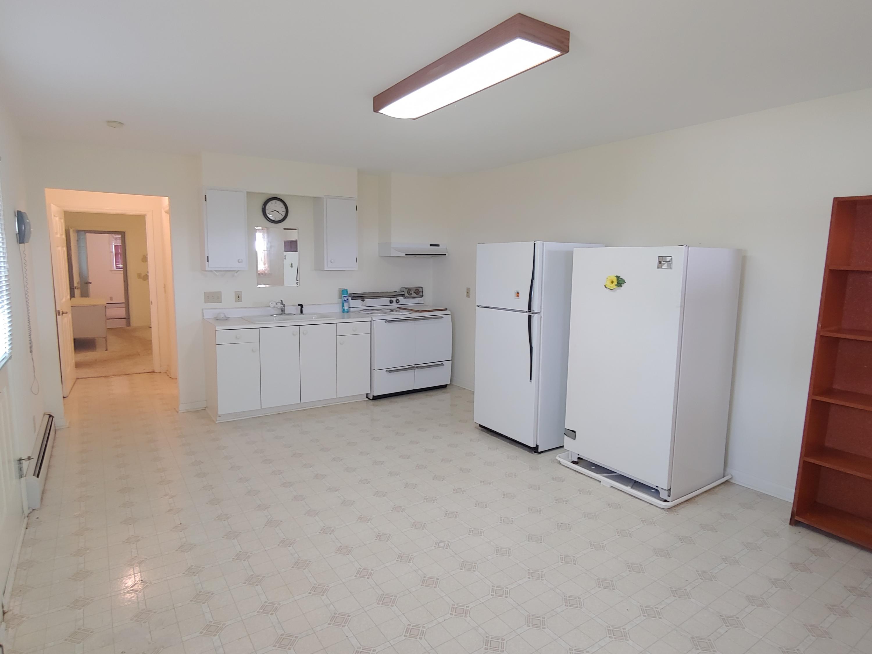 136 Old Fields Road Southwest Floyd, VA 24091 - Photo 53 of 71 a kitchen with white cabinets and white appliances
