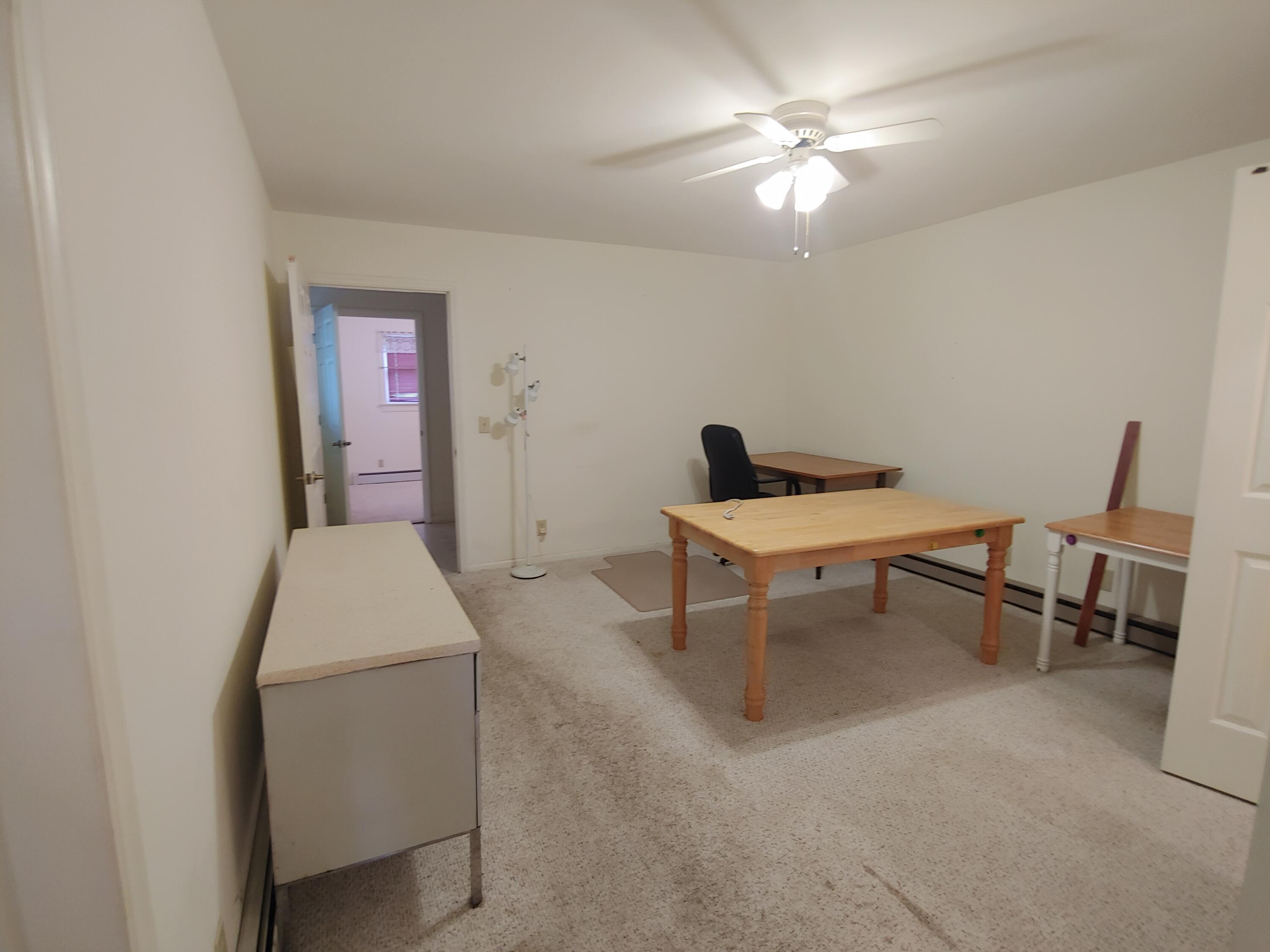 136 Old Fields Road Southwest Floyd, VA 24091 - Photo 54 of 71 a work room with furniture and a chandelier fan