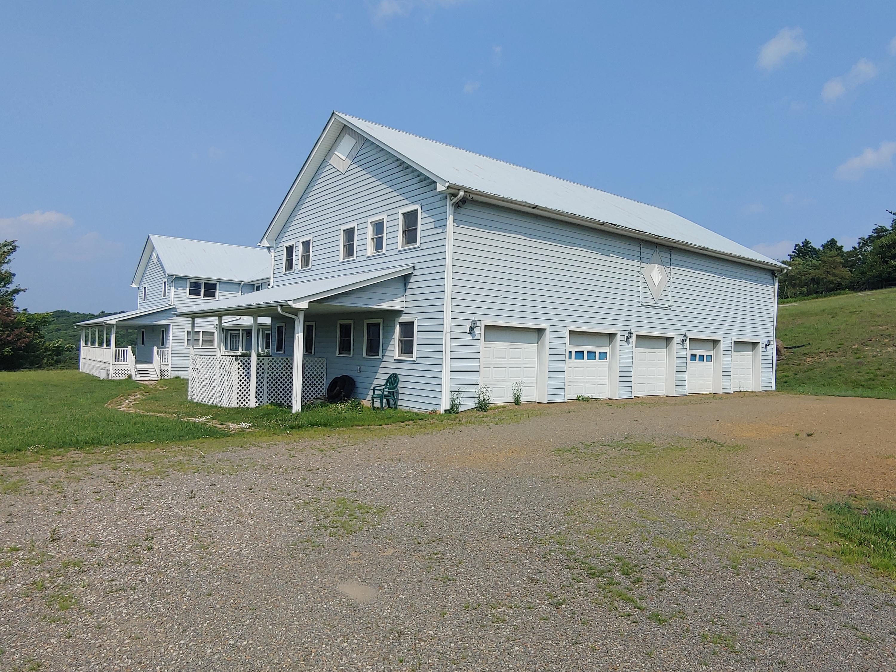 136 Old Fields Road Southwest Floyd, VA 24091 - Photo 65 of 71 a front view of a house with a garden