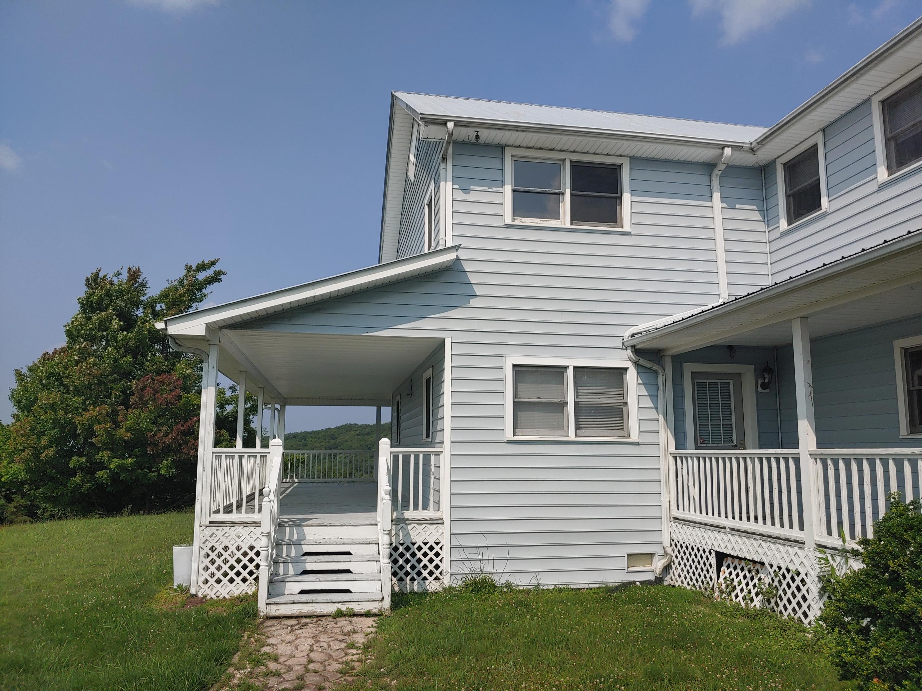 136 Old Fields Road Southwest Floyd, VA 24091 - Photo 10 of 71 a front view of a house with a porch