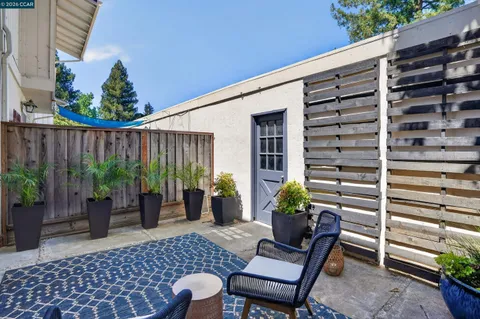a backyard of a house with seating space
