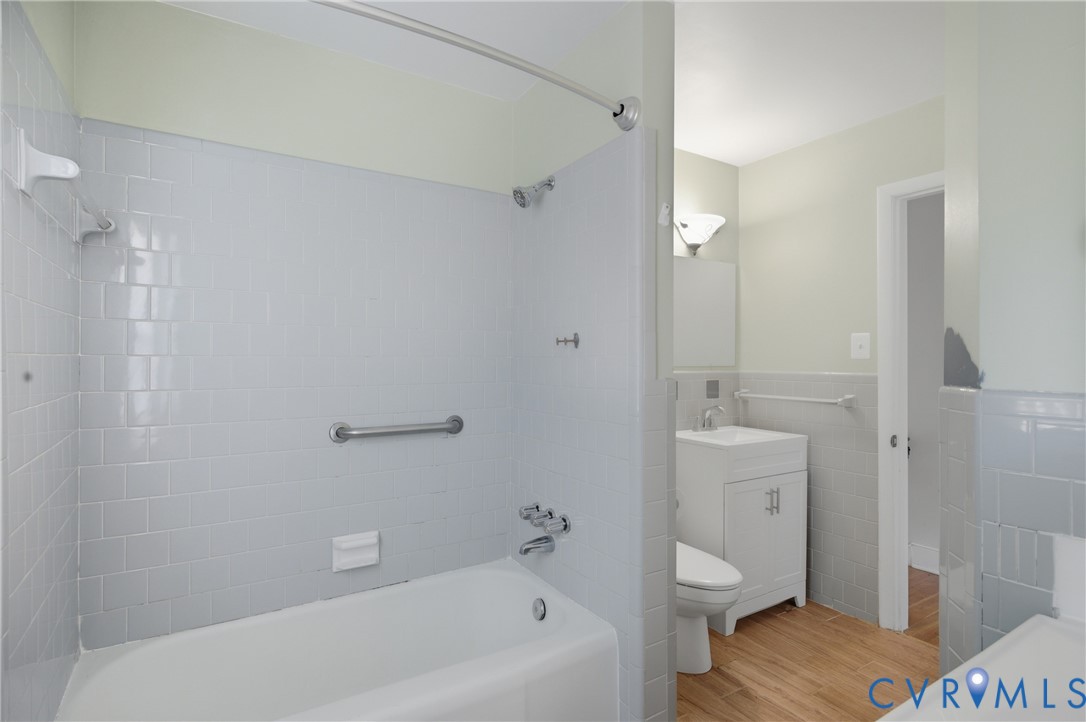 8210 Ireton Road Henrico, VA 23228 - Photo 17 of 36 a bathroom with a granite countertop sink a toilet and shower