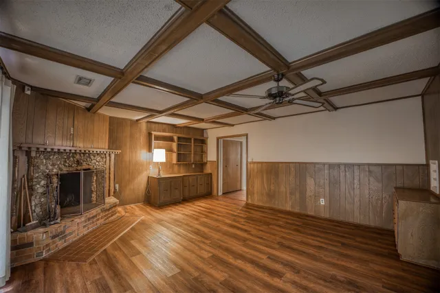 a view of gallery with wooden floor