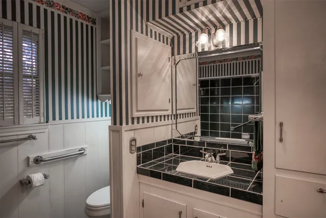 an empty room with a ceiling fan and a window