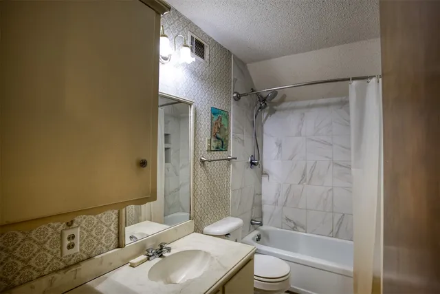 an empty room with windows and entrance