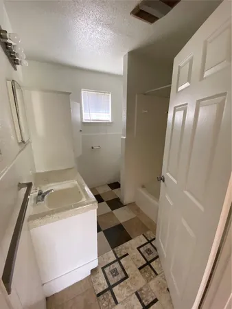 a bathroom with a sink and a shower