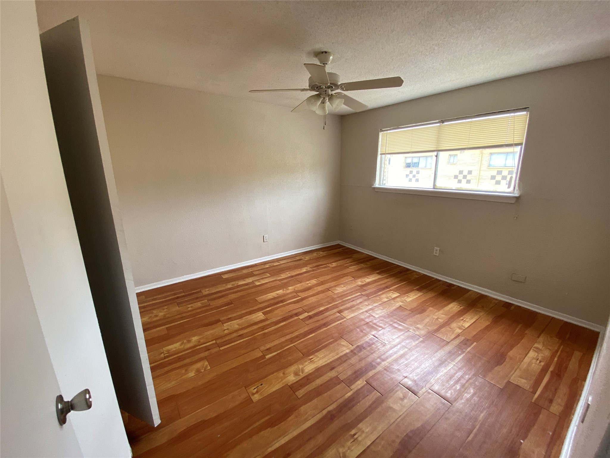 5610 Royal Palms Street, Unit 23 Houston, TX 77021 - Photo 8 of 9 a view of empty room with wooden floor