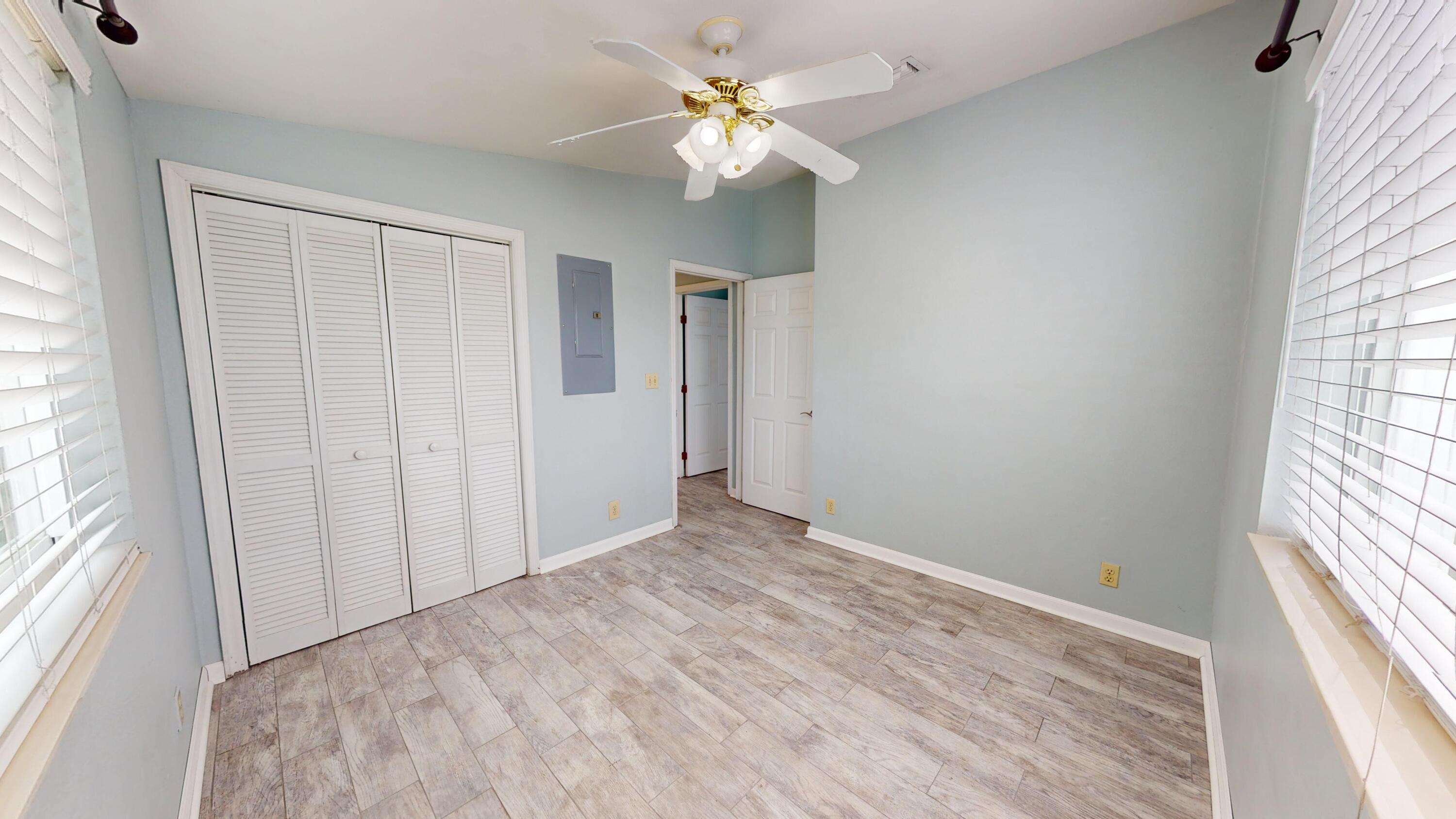 31163 Ave H Big Pine Key, FL 33043 - Photo 10 of 17 wooden floor in an empty room with a window