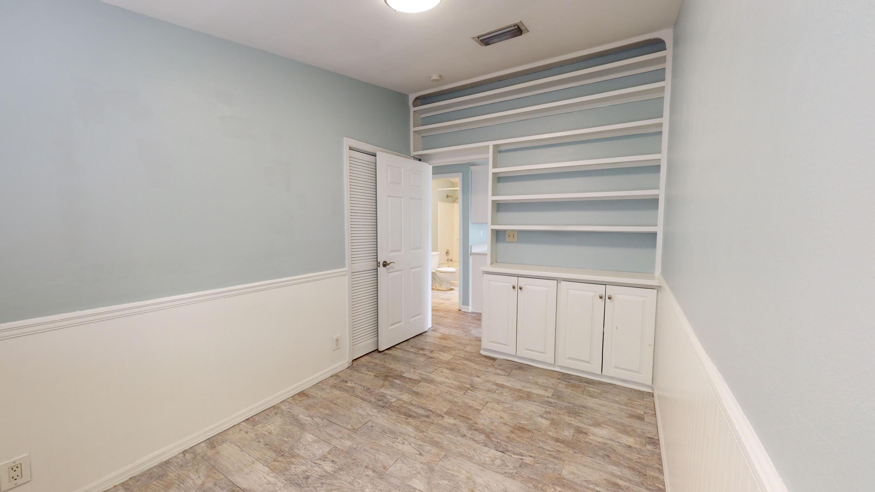 31163 Ave H Big Pine Key, FL 33043 - Photo 13 of 17 a view of walk in closet with empty racks