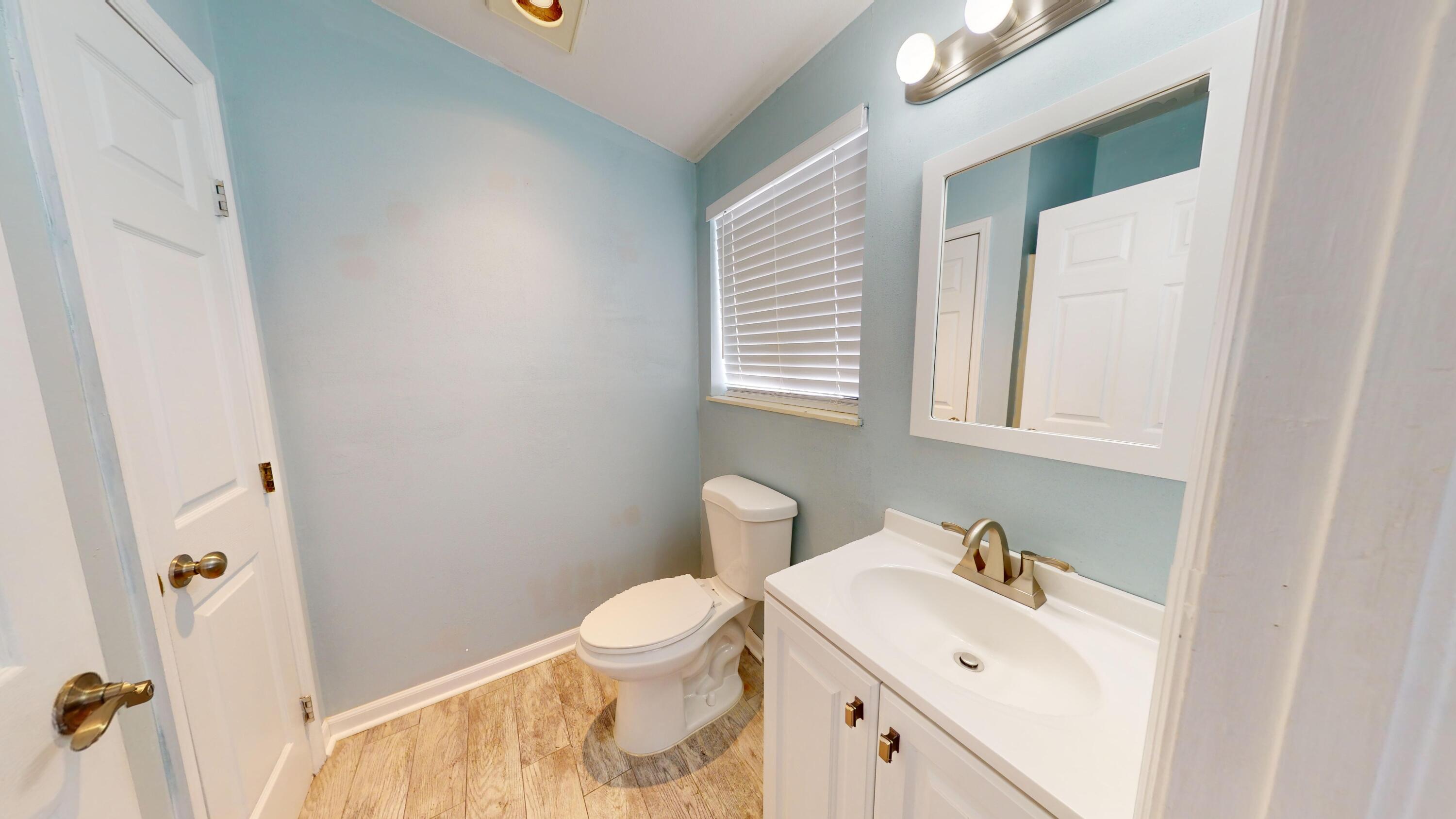 31163 Ave H Big Pine Key, FL 33043 - Photo 15 of 17 a bathroom with a sink toilet and vanity
