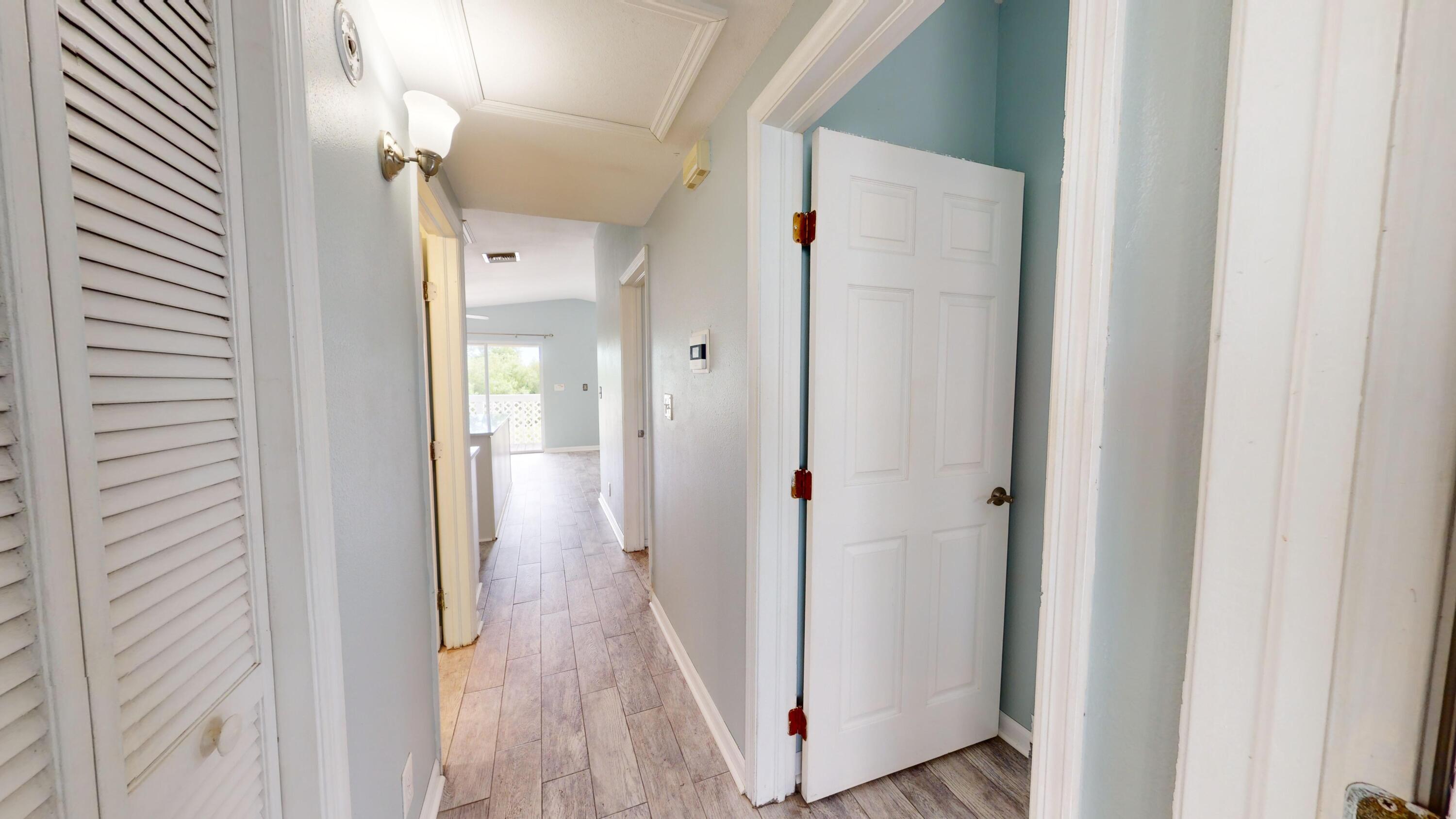 31163 Ave H Big Pine Key, FL 33043 - Photo 16 of 17 a view of a bathroom from a hallway