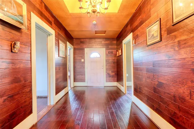 a view of a room with wooden floor and iron stairs