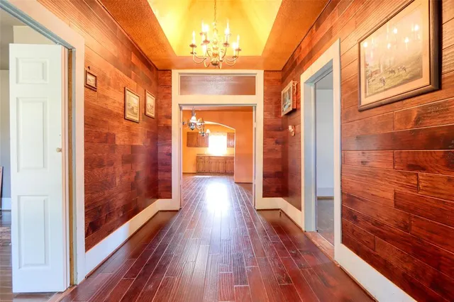 a view of gallery with wooden floor