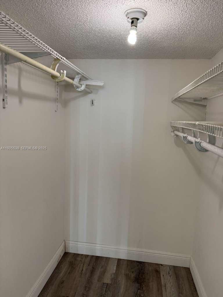 13499 Biscayne Boulevard, Unit 1404 North Miami, FL 33181 - Photo 11 of 13 a view of a room with racks on the wall
