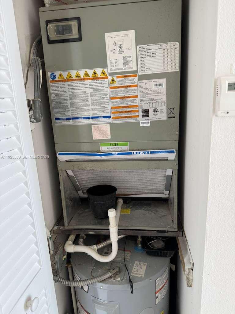 13499 Biscayne Boulevard, Unit 1404 North Miami, FL 33181 - Photo 6 of 13 a utility room with dryer and washer