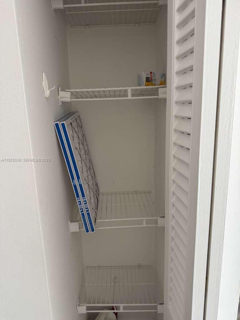 13499 Biscayne Boulevard, Unit 1404 North Miami, FL 33181 - Photo 7 of 13 a close view of closet