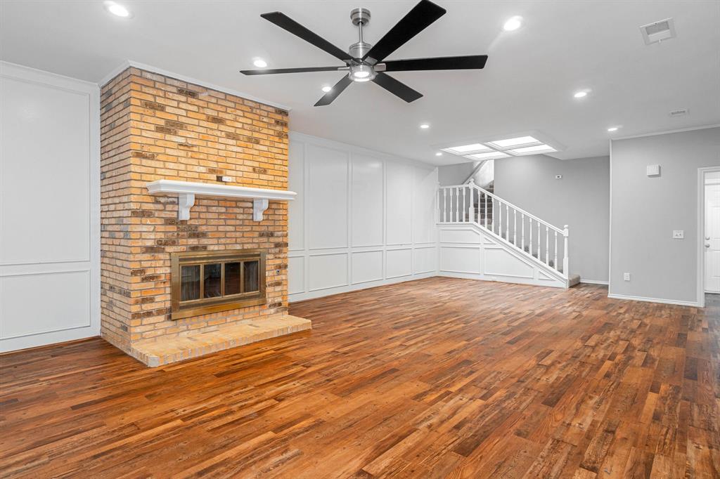 3362 Lanarc Drive Plano, TX 75023 - Photo 1 of 1 a view of an empty room with wooden floor and a fireplace