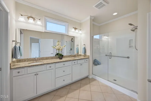 a bathroom with a granite countertop sink mirror and shower