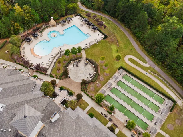 an aerial view of residential houses with outdoor space