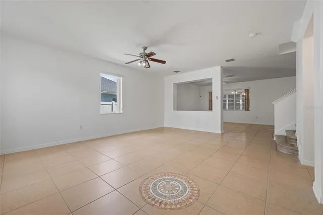 a kitchen with stainless steel appliances granite countertop a refrigerator a stove top oven a sink and dishwasher