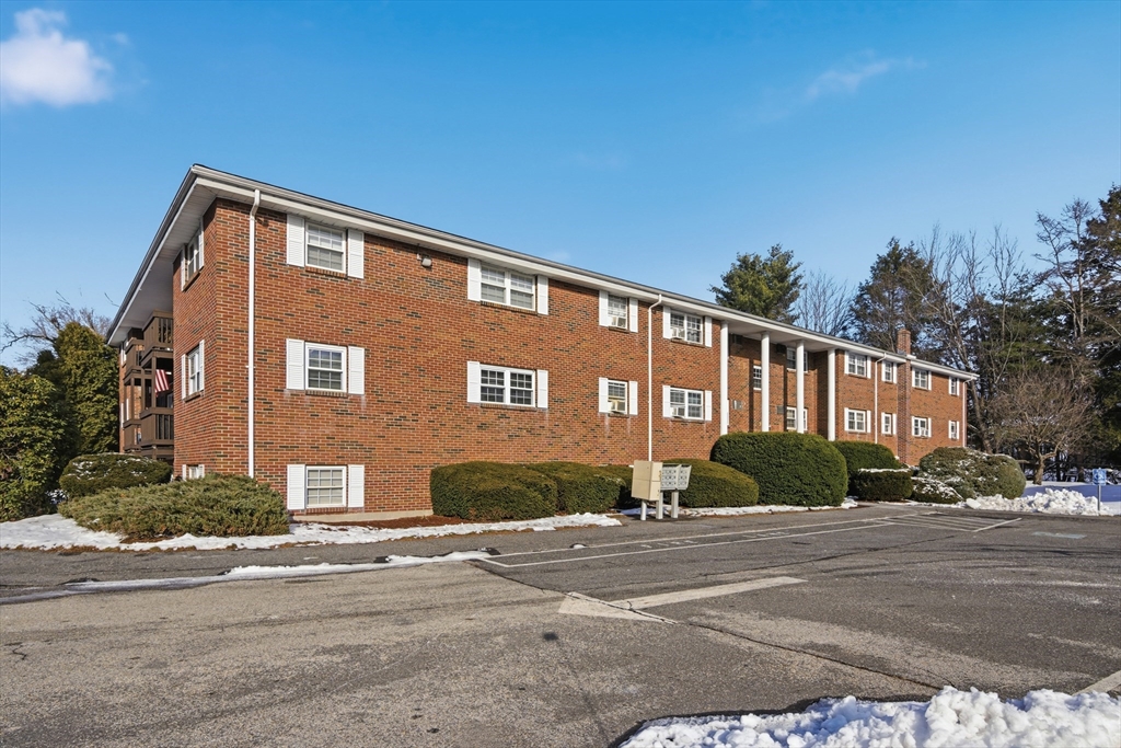 39 Pleasant Street, Unit 7 Northborough, MA 01532 - Photo 21 of 22 a front view of a house with a yard