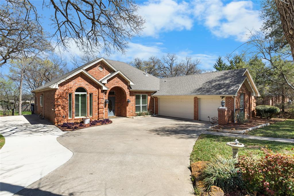 1007 Santa Fe Street Denton, TX 76205 - Photo 2 of 37 a front view of a house with a yard and garage