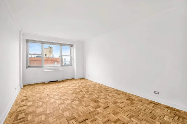 a view of an empty room and window