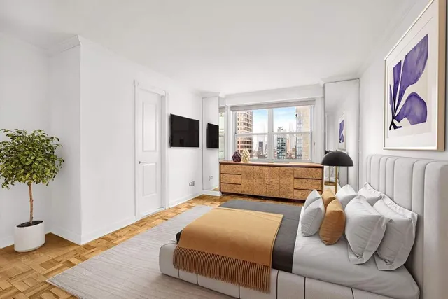 a living room with furniture lamp and window