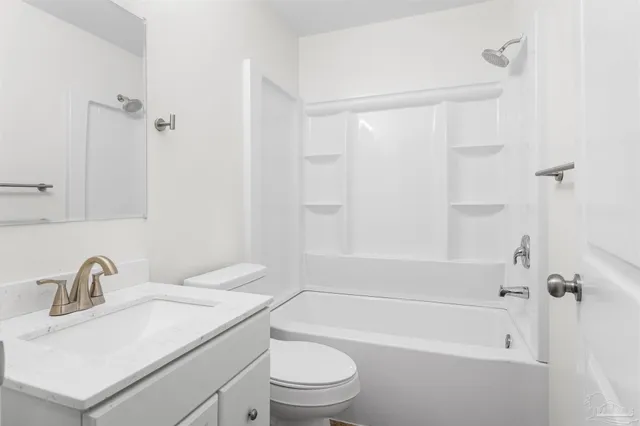 a bathroom with a sink a toilet and a bathtub