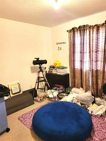 a room with furniture and a wooden floor