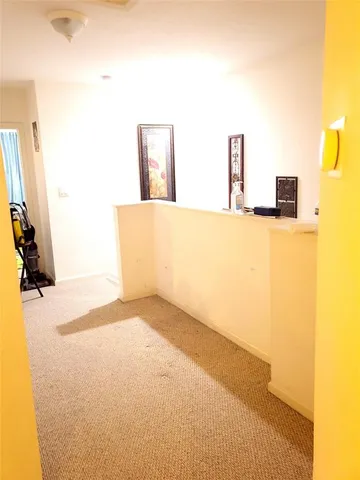 a view of walk in closet with large trees