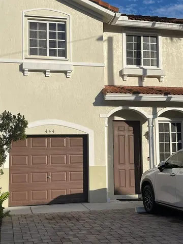 a front view of a house with a garage