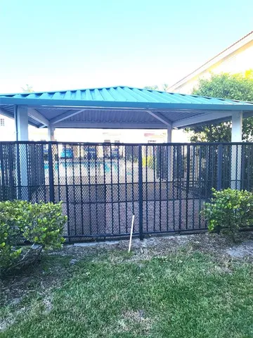 a huge green field with lots of trees
