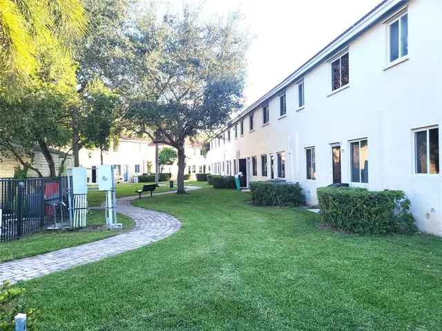 a view of a hallway with washer and dryer