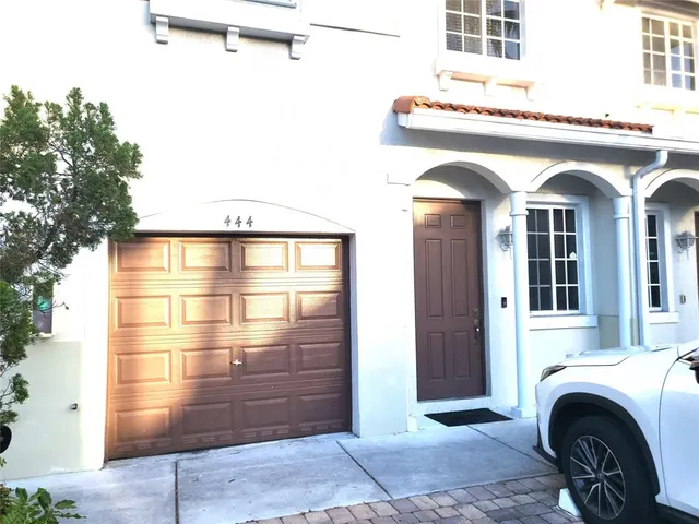 a bedroom with a bed and a cabinet