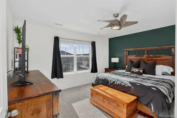 a bedroom with a bed and a table