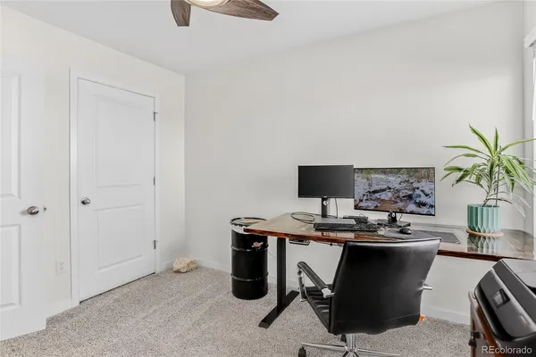 a view of a workspace with furniture