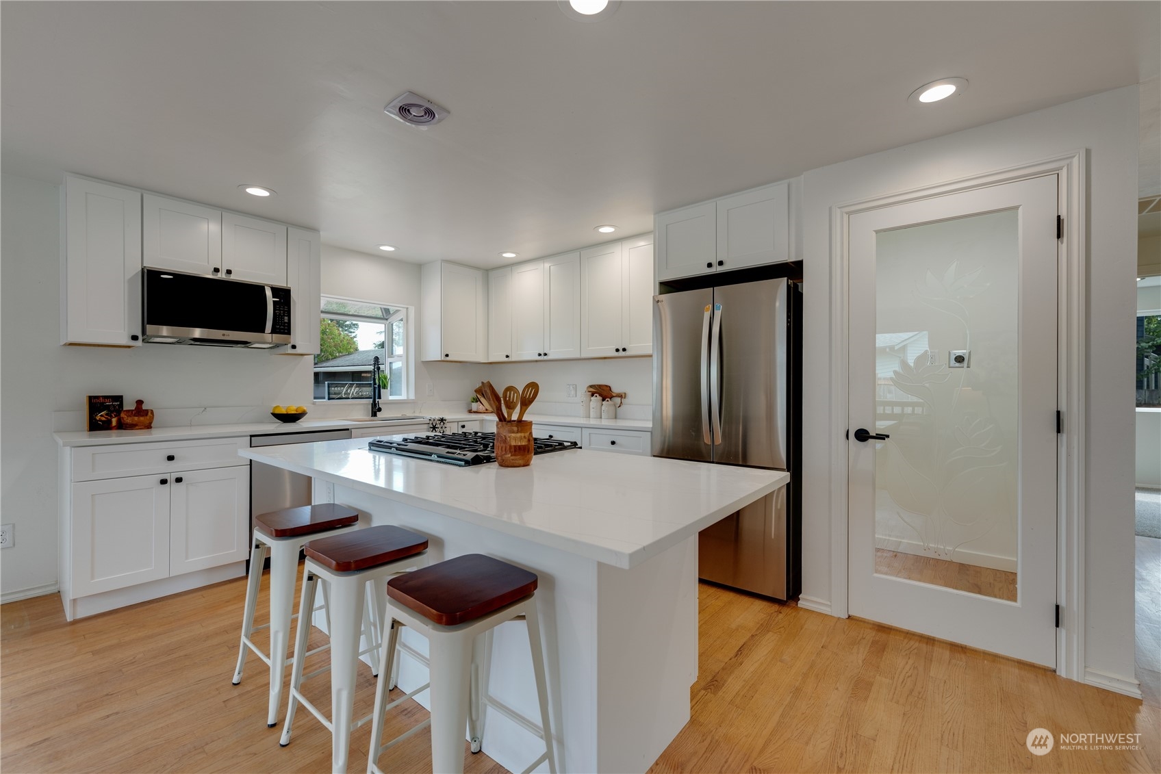 17822 85th Place Northeast Bothell, WA 98011 - Photo 11 of 33 a kitchen with refrigerator and wooden floor