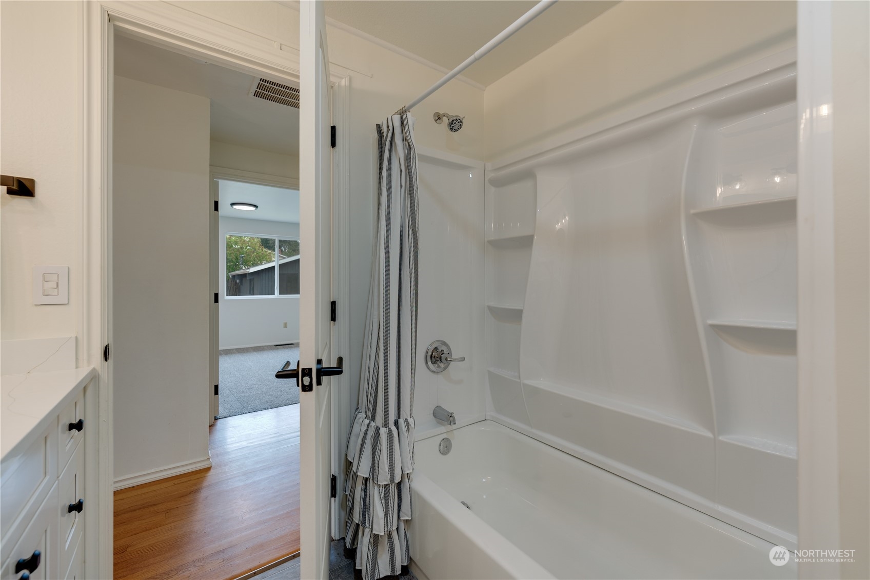 17822 85th Place Northeast Bothell, WA 98011 - Photo 16 of 33 a bathroom with a tub shower vanity and a sink