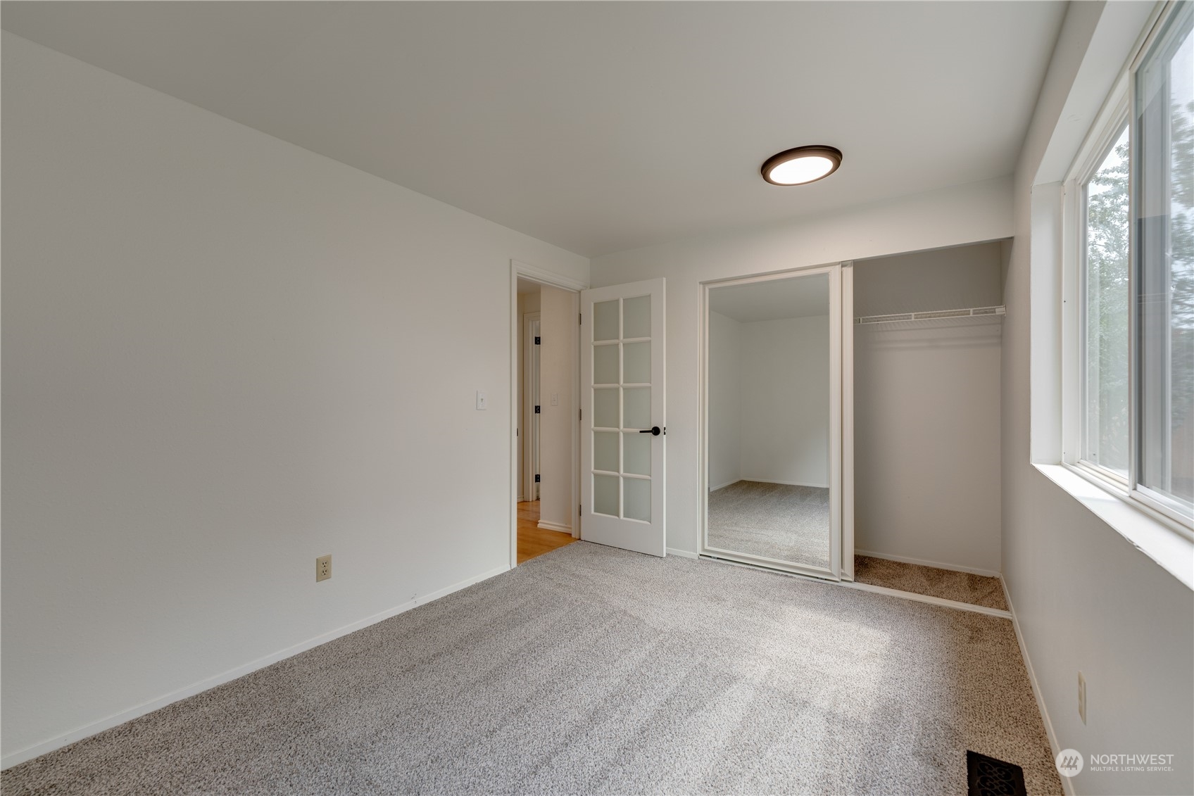 17822 85th Place Northeast Bothell, WA 98011 - Photo 18 of 33 an empty room with closet and a window