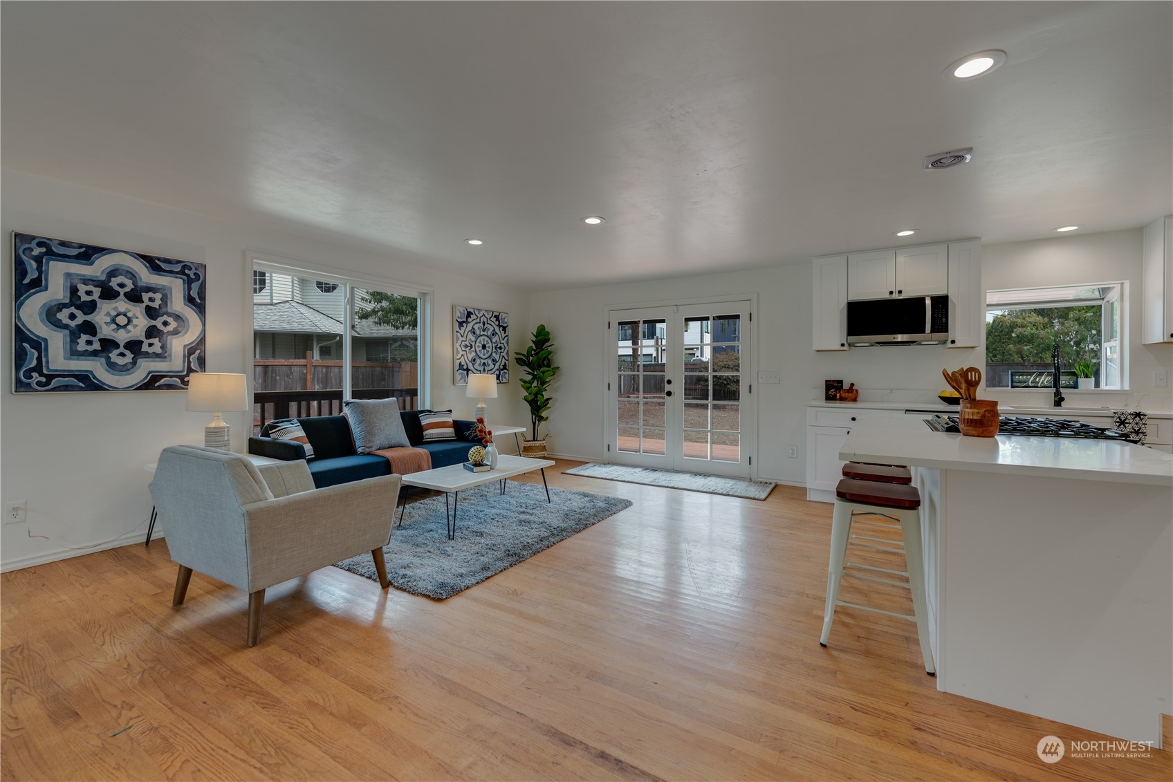 17822 85th Place Northeast Bothell, WA 98011 - Photo 6 of 33 a living room with furniture a flat screen tv and wooden floor