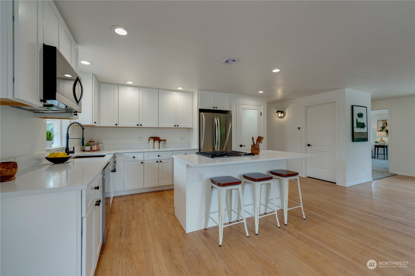 17822 85th Place Northeast Bothell, WA 98011 - Photo 7 of 33 a kitchen that has a lot of cabinets a sink and appliances in it