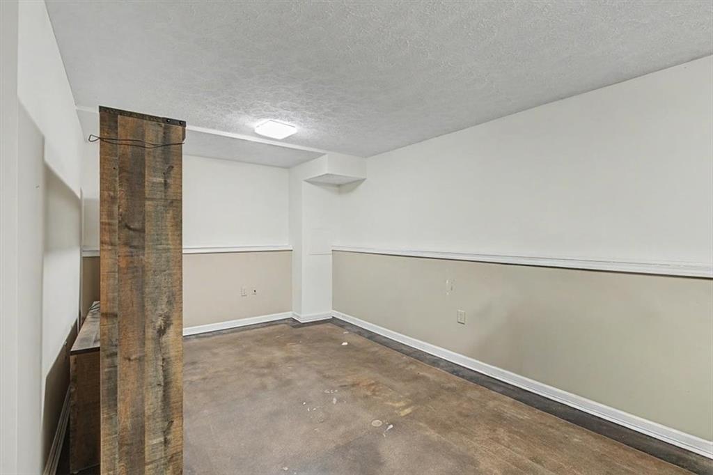 409 Windsor Way Canton, GA 30115 - Photo 28 of 51 a view of an empty room