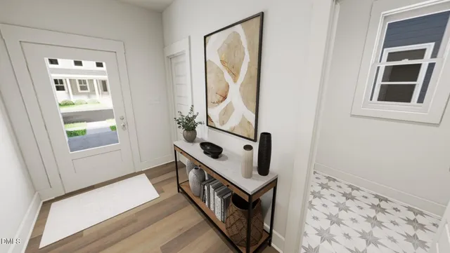 a view of an entryway with wooden floor