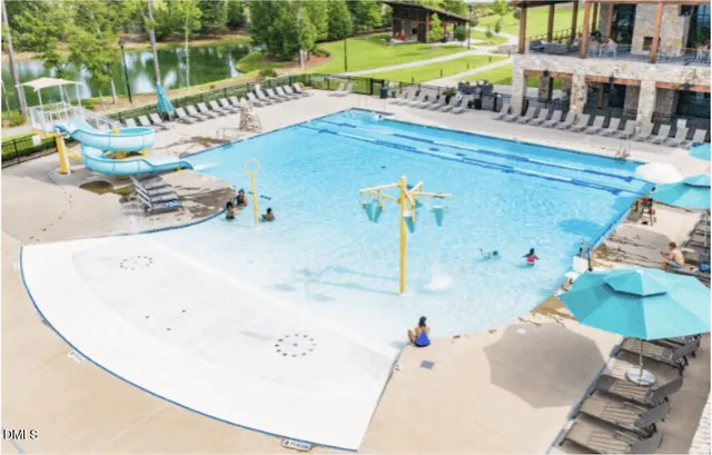 swimming pool view with a sitting space