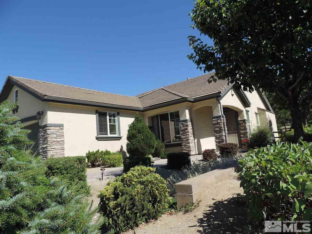 9101 Quilberry Way Reno, NV 89523 - Photo 1 of 20 a front view of a house with a yard
