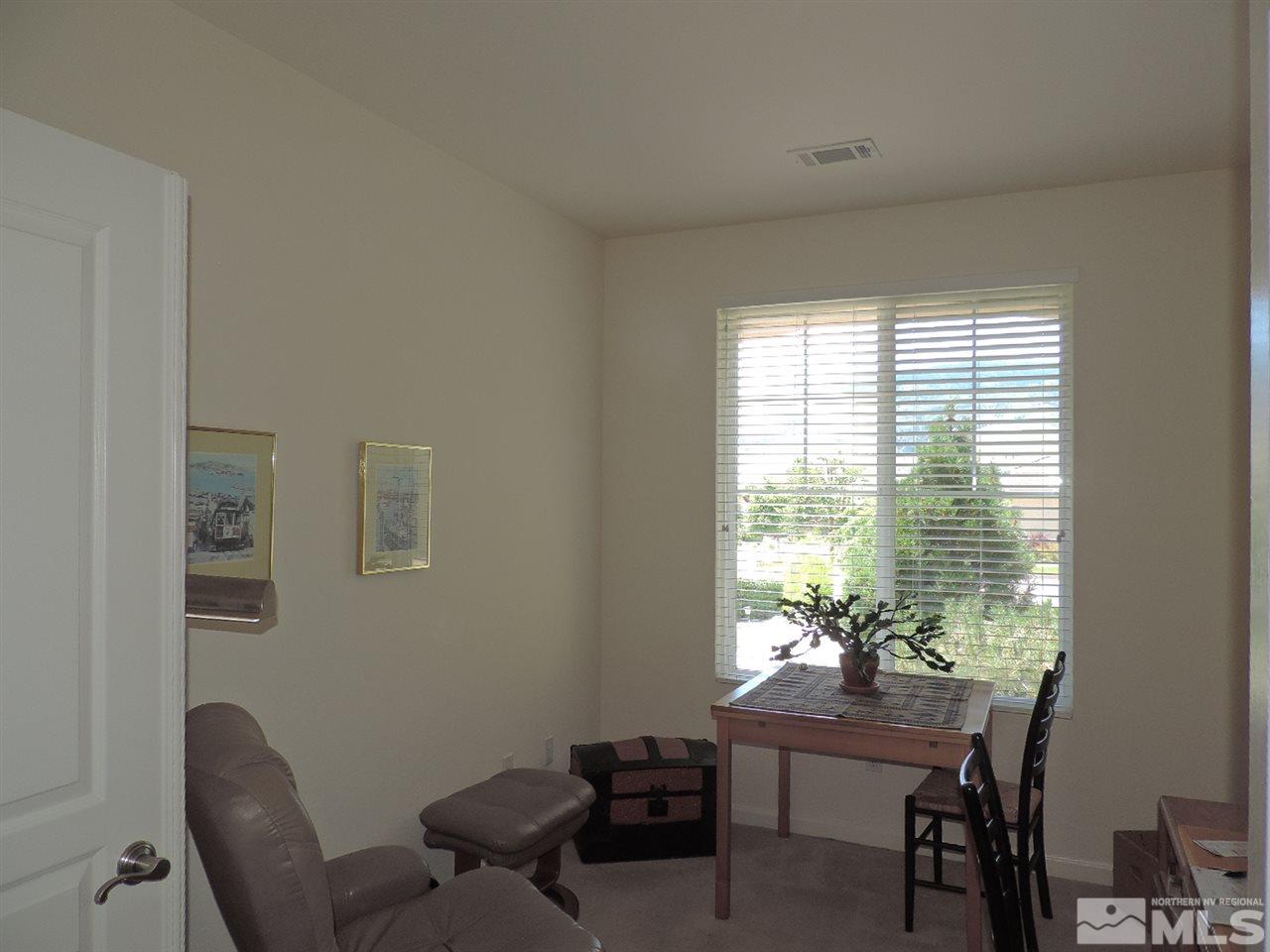 9101 Quilberry Way Reno, NV 89523 - Photo 12 of 20 a view of a workspace with furniture and a window