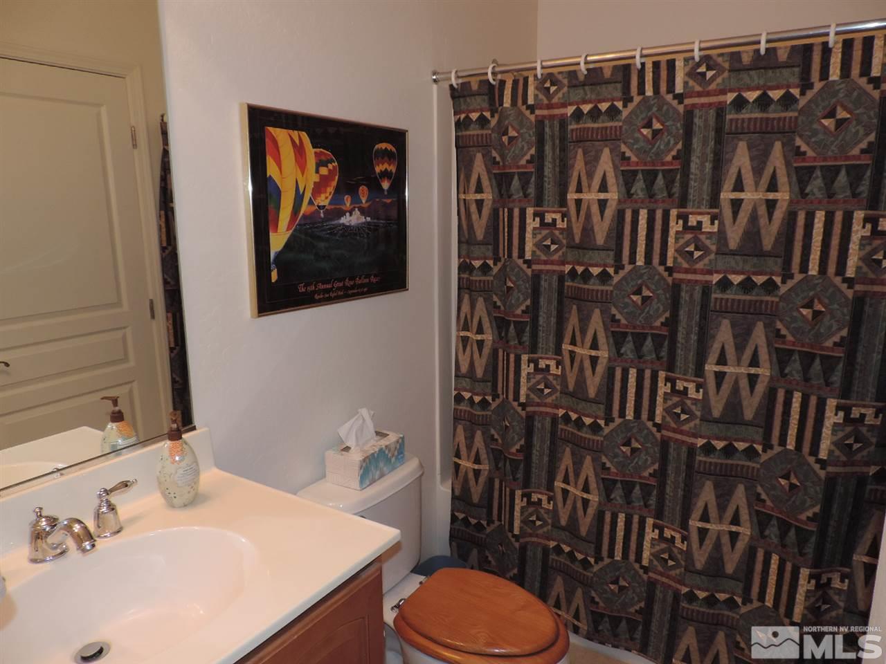 9101 Quilberry Way Reno, NV 89523 - Photo 13 of 20 a bathroom with a sink toilet and vanity