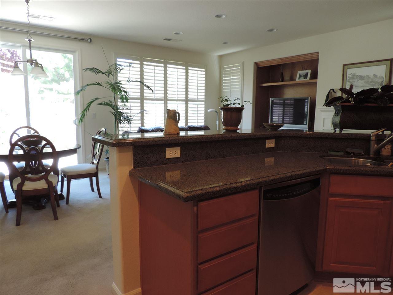 9101 Quilberry Way Reno, NV 89523 - Photo 15 of 20 a kitchen with a sink cabinets and window